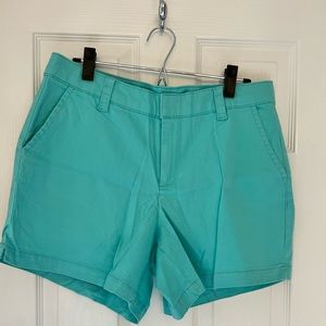 NWOT Teal shorts with pockets and spandex waist.